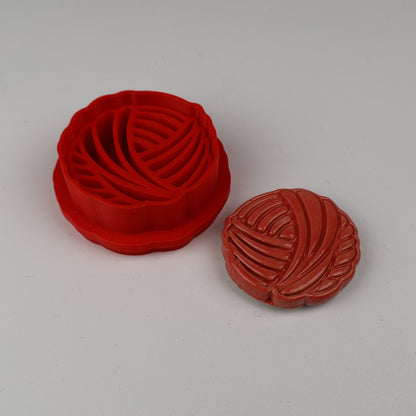 Garnnøgler udstikker med præg